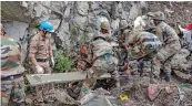  ?? — PTI ?? Army personnel during a rescue operation after a landslide on Wednesday in Kinnaur district.