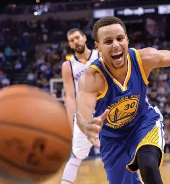  ?? BRANDON DILL/THE ASSOCIATED PRESS ?? Stephen Curry is on pace to smash his record for three-pointers in a season (286). He has made 57 in 11 games.