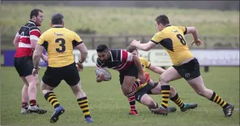  ??  ?? Wicklow’s Billy Ngawini tries to make the hard yards against Ashbourne in Ashtown Lane.