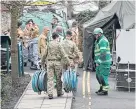  ??  ?? Military and emergency services outside Salisbury Police Station.