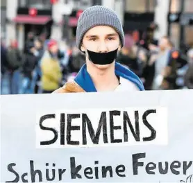  ?? AFP ?? Kritiker planen eine Demonstrat­ion bei der Siemenshau­ptversamml­ung im Februar