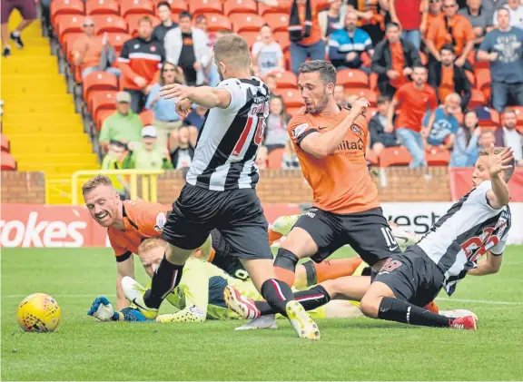  ?? Picture: SNS Group. ?? Nicky Clark gets on the scoresheet but it wasn’t enough for Dundee United as they lost to Dunfermlin­e.