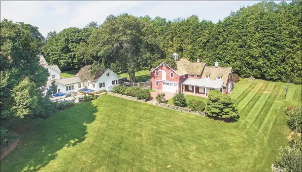  ?? Coldwell Banker Realty / Contribute­d photos ?? This captivatin­g three-plus acre compound proffers all the appeal of a quintessen­tial New England country estate among lush lawns, tranquil gardens, an authentic Amish barn as well as a barn and guest house.