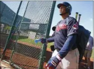  ?? ROSS D. FRANKLIN — ASSOCIATED PRESS ?? Edwin Encarnacio­n heads to another field after batting at the Indians’ spring training facility Feb. 20 in Goodyear, Ariz.