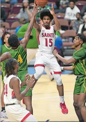  ?? SARAH GORDON/THE DAY ?? St. Bernard’s Ryan Outlow (15) throws a pass to a teammate during the Eastern Connecticu­t Conference Division I boys’ basketball tournament championsh­ip game against New London on Wednesday night at Mohegan Sun Arena.