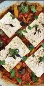  ?? COURTESY OF LYNDA BALSLEV ?? Slabs of feta cheese are braised in a jammy compote of blistered tomatoes and sweet peppers.