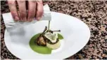  ??  ?? French chef Gilles Reinhardt prepares frog legs in the restaurant of Paul Bocuse “Auberge Du Pont de Collonges” in Collonges au Mont D’Or, near Lyon, central France.