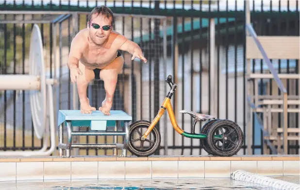  ?? Picture: JUSTIN BRIERTY ?? HARD YAKKA: Grant “Scooter” Patterson in training for the 2020 Paralympic­s and working hard in the pool at Trinity Bay State High School.