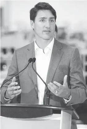  ?? JOHN WOODS / THE CANADIAN PRESS ?? Prime Minister Justin Trudeau, seen at a new Canada Goose factory in Winnipeg, said Tuesday he “won’t be weighing in” on Doug Ford’s efforts to downsize Toronto council.