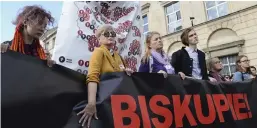  ?? — AP ?? Protesters carry a map of Poland with 255 documented cases of sexual abuse of minors by the country’s Catholic priests as they march in Warsaw, Poland, on Sunday, demanding the church to stop protecting paedophile priests. The writing on the banner reads: ‘ Bishop. Hiding Paedophili­a is a Crime.’