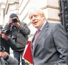  ?? REUTERS ?? Britain’s Prime Minister Boris Johnson walks near Downing Street, in London on Tuesday.