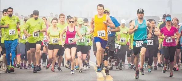  ?? GORDON POTHIER ?? Participan­ts in last year’s Wedgeport Tuna Fun Run are on their way. They had the option of running a 5K or 10K.