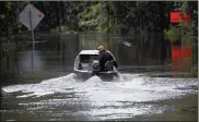  ?? GERRY BROOME / AP 2005 ?? Hunter Baker drives his boat to his home following heavy rains in Florence, S.C. Meteorolog­ists’ forecasts are getting more accurate.