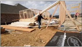  ?? (AP/Rogelio V. Solis) ?? Workers frame a house March 16 in Madison County, Miss. U.S. constructi­on spending fell in February after several months of steady gains.