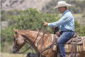  ??  ?? To initially teach your horse to back and pull the log, loop the rope in a “U” shape around the saddle horn, not making a full circle around it, so you can quickly release the rope if needed.
[
]