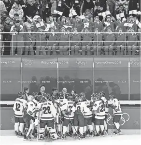  ??  ?? Cheered from above, North and South Koreans on the Korean women’s ice hockey team lost to Switzerlan­d on Saturday. ANDREW NELLES/USA TODAY SPORTS