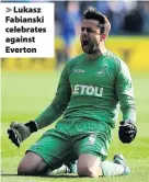  ??  ?? > Lukasz Fabianski celebrates against Everton