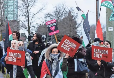  ?? JEFF KOWALSKY/AFP VIA GETTY IMAGES ?? People gather in support of Palestinia­ns outside where President Joe Biden was speaking to the United Auto Workers in Warren, Mich., on Feb. 1.