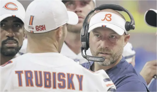 ?? MICHAEL CONROY/AP ?? Coach Matt Nagy (talking with Trubisky last season) says he wants the QB competitio­n to be fierce and close to “make it hard on us to make the decision.”