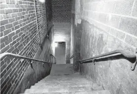  ??  ?? Stairs lead to the tunnels and vaults beneath Lexington Market. Tours of the belowgroun­d passages are held the second Saturday of most months.