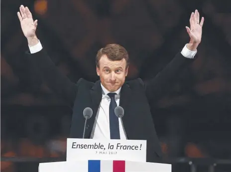  ??  ?? Speaking to thousands of supporters from the Louvre Museum's courtyard, president-elect Emmanuel Macron says France is facing an "immense task" to rebuild European unity, fix the economy and ensure security against extremist threats.