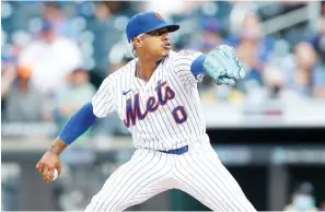  ?? Jim McIsaac/Getty Images/TNS ?? ■ In this file photo, Marcus Stroman (0) of the New York Mets pitches Sept. 28 in the first inning against the Miami Marlins at Citi Field in New York City. Chicago Cubs signed right-hander Marcus Stroman to a three-year deal.