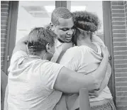  ?? Karen Warren / Houston Chronicle ?? Alfred Brown walks out of the Harris County Jail and into the arms of his sister Connie Brown, left, and daughter Kierra Brown, 15, on Monday.