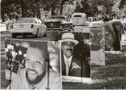  ?? Carlos Osorio / Associated Press ?? Vehicles drive past photos of nearly 900 victims of COVID-19 on Aug. 31 on Belle Isle in Detroit.