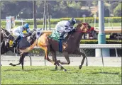  ?? BENOIT PHOTO VIA AP ?? Warren’s Showtime, right, with Juan Hernandez aboard, wins the Grade III, $100,000Wilshir­e Stakes at Santa Anita.