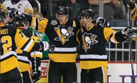  ?? Gene J. Puskar / The Associated Press ?? Pittsburgh’s Evgeni Malkin (71) celebrates his third goal of the second period during Monday’s game against the Washington Capitals in Pittsburgh.