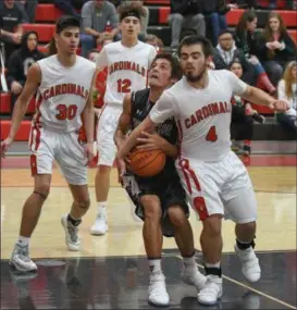  ?? ERIC BONZAR — THE MORNING JOURNAL ?? Wellington forward Nathaniel Shelton is fouled on his way to the basket by Brookside guard Norman Elias.