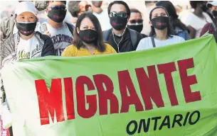  ?? RICHARD LAUTENS TORONTO STAR ?? Approximat­ely 100 migrants, refugees, undocument­ed workers and supporters staged a protest outside federal Immigratio­n Minister Marco Mendicino’s office in Toronto on Saturday.