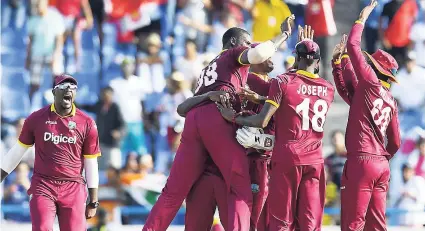  ??  ?? Windies players celebratin­g a wicket.