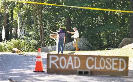  ?? Peter Hvizdak / Hearst Connecticu­t Media ?? State Rep. Sean Scanlon, left, and Ted Killiam, a resident of Denison Drive in Guilford, look over the damage on Denison Drive from tropical storm Isaias as Scanlon visited the area on Saturday.