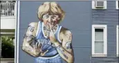  ?? DARRON CUMMINGS — THE ASSOCIATED PRESS ?? A mural of former NBA star Larry Bird is seen on Wednesday in Indianapol­is. Larry Bird likes the mural but not the tattoos. Bird’s attorney, Gary Sallee, says the former Indiana Pacers executive “needs to protect” his brand and “doesn’t want to be seen as a tattooed guy.” Artist Jules Muck says she was just trying to be funny.