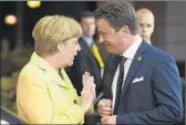  ?? John Thys AFP/Getty Images ?? LUXEMBOURG’S Xavier Bettel and German Chancellor Angela Merkel attend a July meeting.