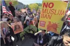  ?? MANUEL BALCE CENETA/AP ?? Protesters gather at a rally in Washington on Oct. 18. The Supreme Court is allowing the Trump administra­tion for now to fully enforce a ban on travel to the United States by residents of six mostly Muslim countries.