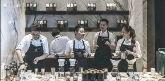  ?? BLOOMBERG ?? Starbucks Corp employees prepare coffee at a store in Shanghai.