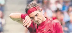  ??  ?? Federer reacts after losing a point. — AFP photo