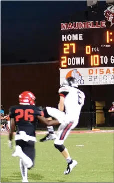  ??  ?? Freshman Blackhawk Trevor Blair (No. 8) caught a pass from quarterbac­k Tate Busey just before being tackled by a Hornet lineman. Blair led the receivers with 98 yards on seven catches.