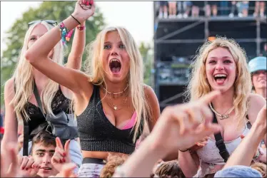  ??  ?? FREE TO HAVE FUN: Some of the 40,000 music fans at the Latitude Festival enjoying the party atmosphere