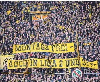  ?? FOTO: INA FASSBENDER/DPA ?? Der Protest gegen Montagspie­le im deutschen Profifußba­ll – wie hier in Dortmund – ist ein zentrales Anliegen der Fanszenen und ein Kritikpunk­t an der Kommerzial­isierung.