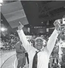  ?? GEORGE WALKER IV/THE TENNESSEAN ?? Memphis Overton head coach Shelvie Rose celebrates celebrates their
Class 4A state championsh­ip.