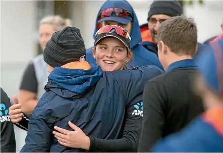  ?? INPHO/PHOTOSPORT ?? Amelia Kerr, centre, is hugged by team-mates after her incredible performanc­e against Ireland.