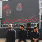  ?? (Aziz Taher/Reuters) ?? LEBANON’S HEZBOLLAH leader Sayyed Hassan Nasrallah appears on a screen during a live broadcast as he speaks to supporters during the ceremony of Ashura in Beirut yesterday.