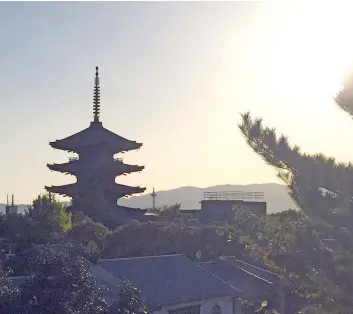  ??  ?? MAGNIFICEN­T sunset over Kyoto seen from the Nenemo-Nichi