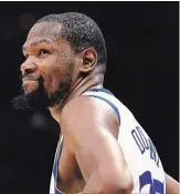  ?? GREGORY SHAMUS GETTY IMAGES ?? Kevin Durant of the Golden State Warriors reacts against the Cavaliers in the second half of Game 3 of the NBA finals in Cleveland on Wednesday night. Durant’s monster game has the Warriors up 3-0 in the best-of-seven series.