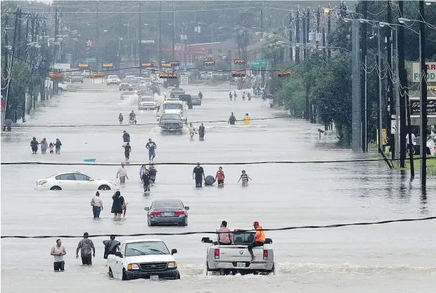  ?? THOMAS B. SHEA / AFP / GETTY IMAGES ?? Telephone Road in Houston on Sunday. While the governor of Texas thought there should be evacuation­s ahead of Hurricane Harvey, the mayor of Houston and officials in Harris County disagreed, urging residents to hunker down and ride out the storm.