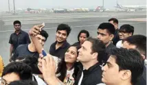  ?? PTI ?? Fans take selfies with Congress vice-president Rahul Gandhi at the airport in Surat on Wednesday