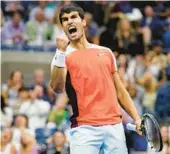  ?? CHARLES KRUPA/AP ?? Carlos Alcaraz, 19, celebrates after winning a point during his victory over Casper Ruud in the U.S. Open final Sunday in New York.